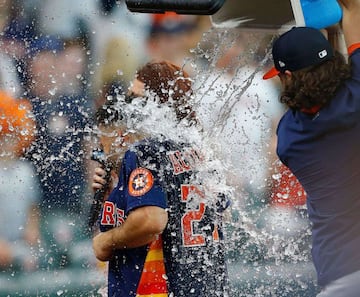 HOUSTON, TEXAS - JULY 11: Lance McCullers Jr. #43 of the Houston Astros dumps water on Jose Altuve after he hit a three run walk off home run in the ninth inning to beat the New York Yankees 8-7 of the Houston Astros at Minute Maid Park on July 11, 2021 i